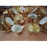 A gilt decorated part coffee service and similar