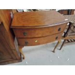 A mid 20th Century walnut chest of two drawers on cabriole legs