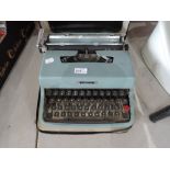 A vintage Ollivetti Lettera 32 typewriter in case