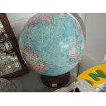 A paper globe on treen stand
