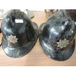 Two vintage Fire Service helmets one Cumbria, one Carlisle