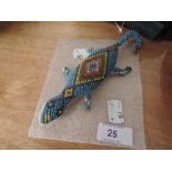 A beaded work lizard dated 1916