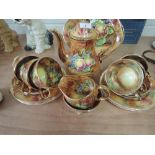 A Baroness part tea service in transfer printed fruit and gilt design by A Mellori, 22 pieces