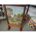 A oak framed tapestry fire screen