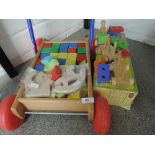 A push along wooden toy, a Chad Valley pull along wooden train with blocks etc