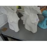 Two ceramic vases in the form of horse heads