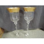 A pair of Colonial decorative wine glass shaped, twist stemmed glass bowls with gilt rim, approx