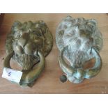 Two brass lion head door knockers