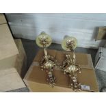 A pair of gilt candle style wall light fittings