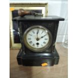 A Victorian marble and granite mantle clock with pendulum movement