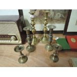 A selection of Victorian and later brass candle sticks one very heavy solid cast pair