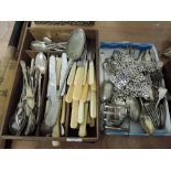 A large selection of flatware and cutlery including spoons knifes forks butter knifes etc