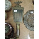 An early brass carriage lamp with a regency style adorned with a cast eagle