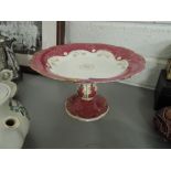 A ceramic tazza/ cake stand in red and gilt