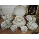 A part tea service by Shelley with gold gilt and hand enamel detailing 40 pieces approx
