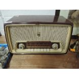 A vintage Grundig Fleetwood radio in an attractive burgundy plastic body