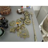 A selection of brass and copper ware, arts and craft style trivet, horse brasses