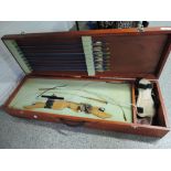 A vintage Petron composite bow with case with straps and arrows