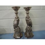 A pair of large cast candle sticks in the form of two wise owls