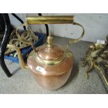 A vintage large copper and brass stove kettle