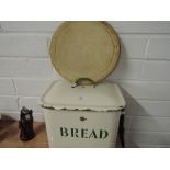 A vintage tin bread bin with cream and green enamel