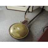 A copper and brass bed warmer pan with turned treen wood handle