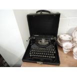 A vintage typewriter made by Carona black cast body with large keys