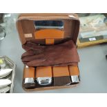 A vintage gentleman travel vanity shave and wash set with matching leather drivers gloves