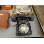 A vintage bakelite telephone with Call Exchange badge