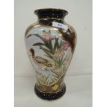 An early 20th century Japanese vase having pictorial panel decoration