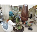 A selection of vintage ceramic and treen decorative items including duck, cat, beaver, rabbits