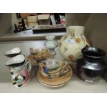 A selection of vintage ceramics including miniature Toby style jugs