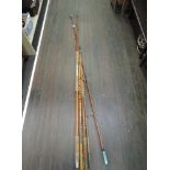 A selection of fishing and tackle related items including three vintage rods