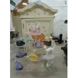 A selection of cats playing on semi precious stones and cat house