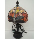 A Tiffany style table top lamp with dragonfly decal