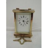 A bevel edged glass and brass carriage clock in a French style