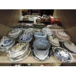 A large selection of tureens and display plates some antique delft style