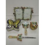 A selection of decorative butterfly related items including spy glass and picture frame