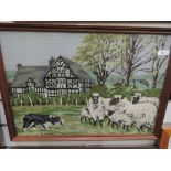 Two cross stitch pictures depicting countryside scenes