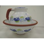 A vintage jug and bowl set with a Mediterranean style