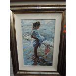 A modernist print in attractive frame depicting child at sea side
