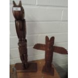 Two treen carved totem poles