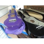 Two ukuleles , labelled Martin Smith and Red Star