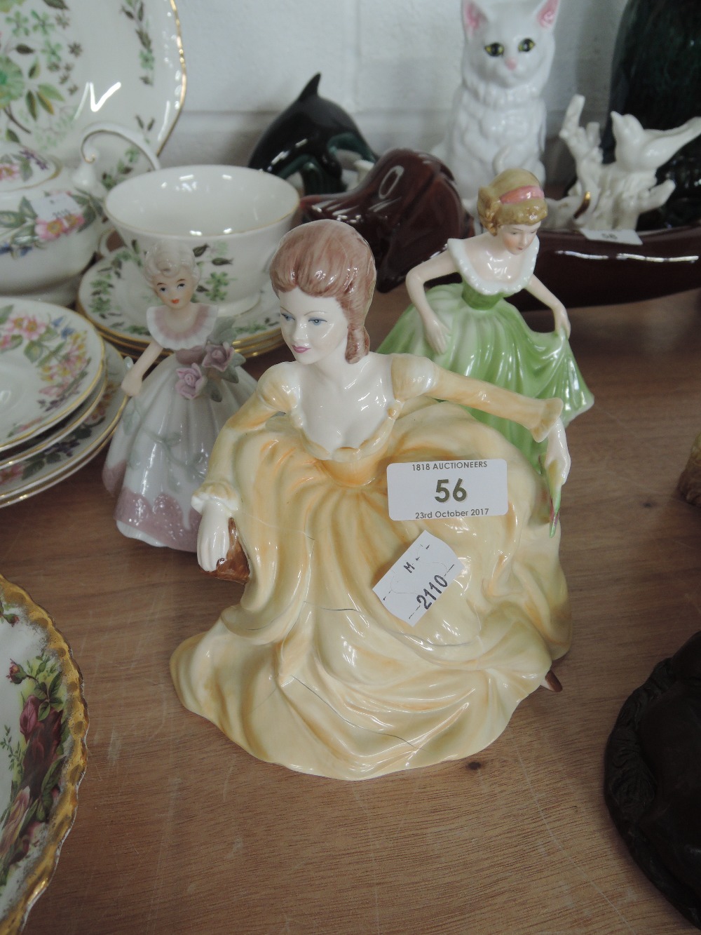 A Coalport and two similar figurines (A/F)