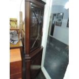 A late 20th Century reproduction mahogany corner display cabinet having cupboard under