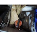 A half size traditional violin, selection of bows and a wooden table top music stand