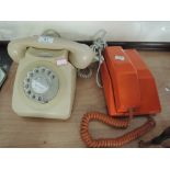 Two vintage telephones.