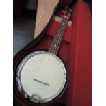 A vintage banjo ukulele, George Formby model with printed signature to skin, in vintage case