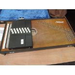 An Oscar Schmidt Educator auto harp, model OS-30C serial number 19745, fitted with pick up and