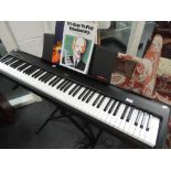 A Kawai ES100 digital piano, stand, pedals, PSU etc